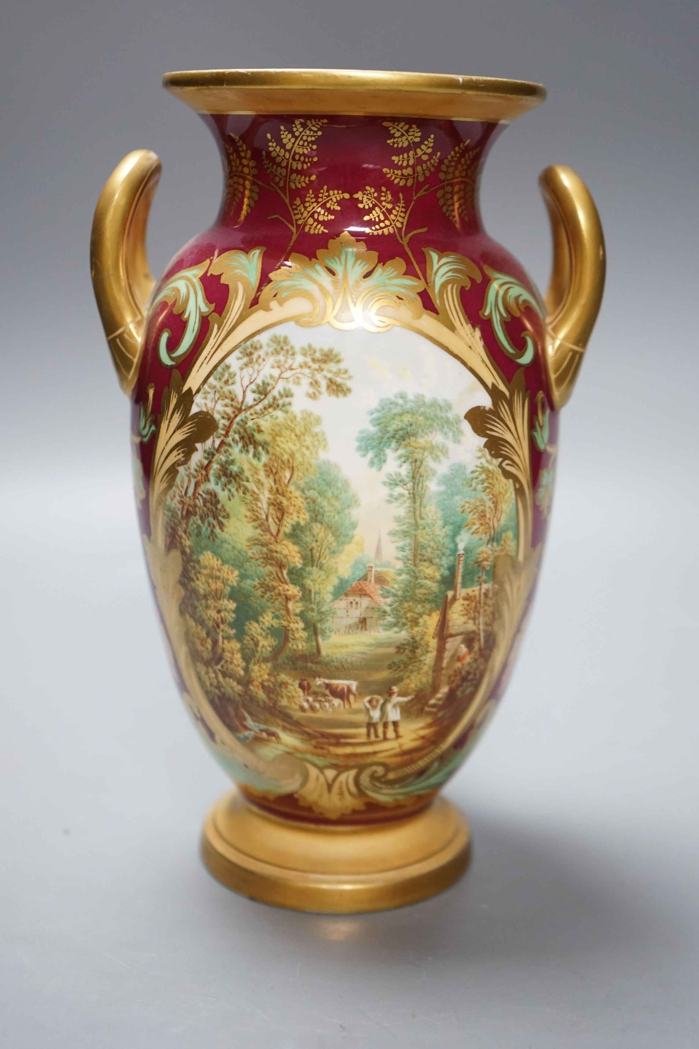 A 19th century English bone china two handled vase, decorated with a central cartouche, in distinctly signed on base, 21.5cms high